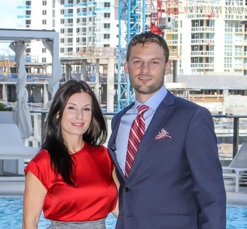 Jim and Olga Blackburn in front of Fort Lauderdale construction skyline